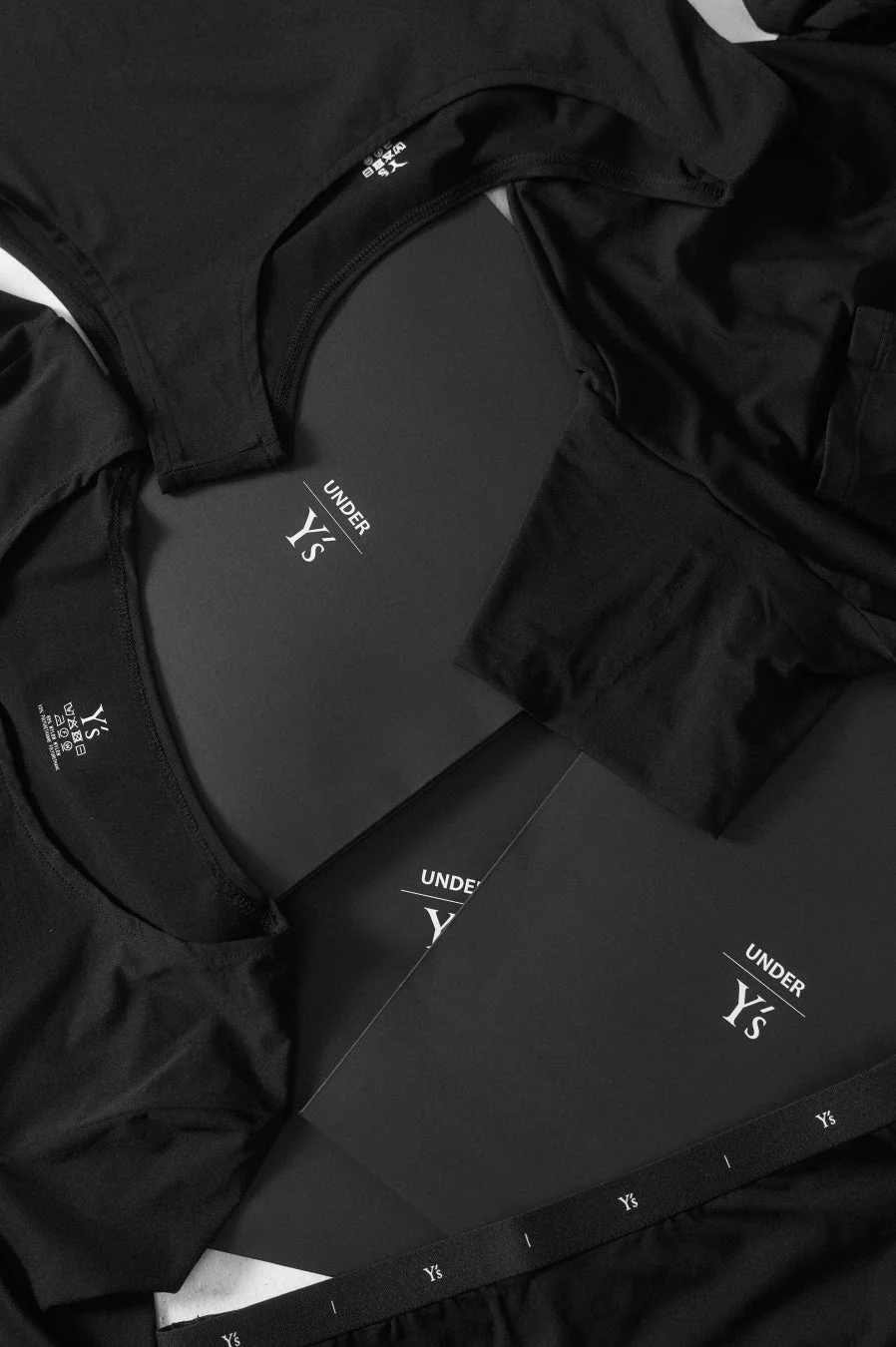 UNDER Y's collection with black underwear and packaging