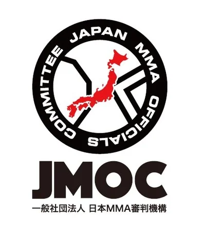 日本MMA審判機構（JMOC）のロゴマークです。円形のデザインには「COMMITTEE JAPAN MMA OFFICIALS」と書かれており、中央に日本の地図が赤く描かれています。