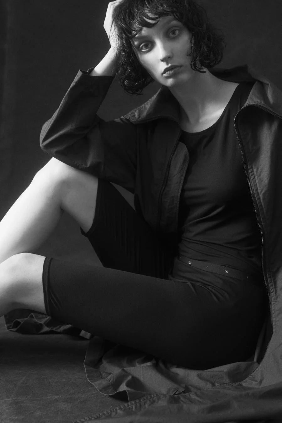 Monochrome portrait of a woman with short hair sitting